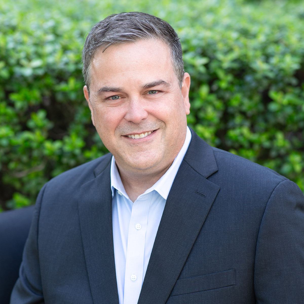 Portrait of Derk Burrus, Business Operations Analyst supporting financial planning and operational strategy at Bluespring Wealth California