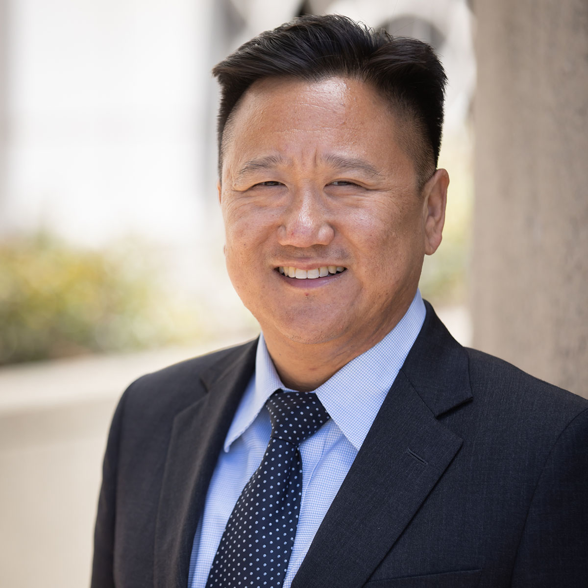 Portrait of John Chang, Wealth Advisor providing wealth management and retirement planning guidance at Bluespring Wealth California