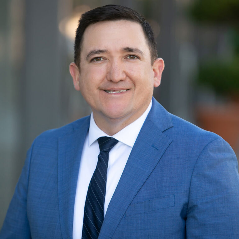 Portrait of Justin Amit, Wealth Advisor supporting financial planning and investment management services at Bluespring Wealth California