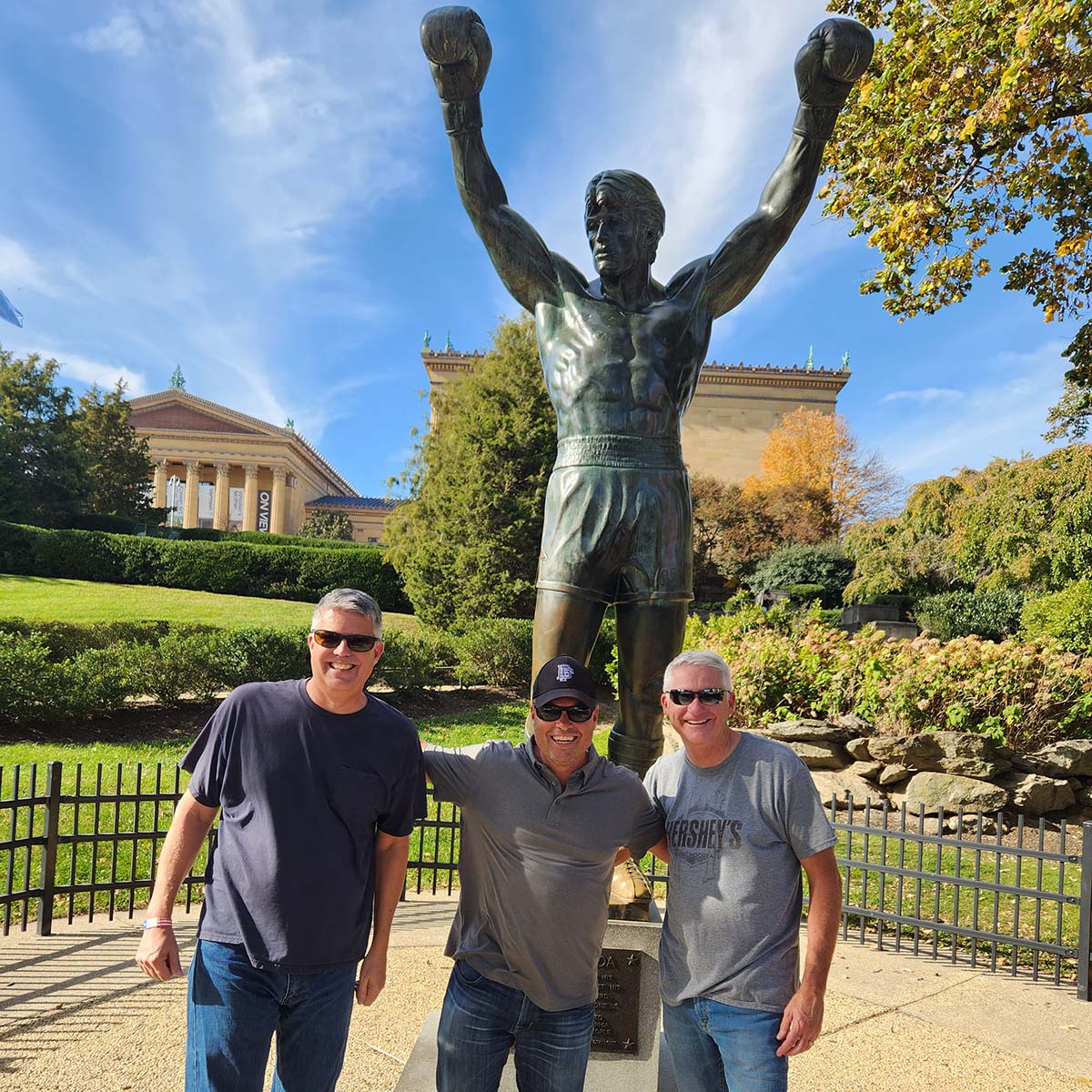 Team trip to the Rocky statue in Philadelphia representing company culture, leadership camaraderie, milestone celebrations, and shared experiences outside the workplace
