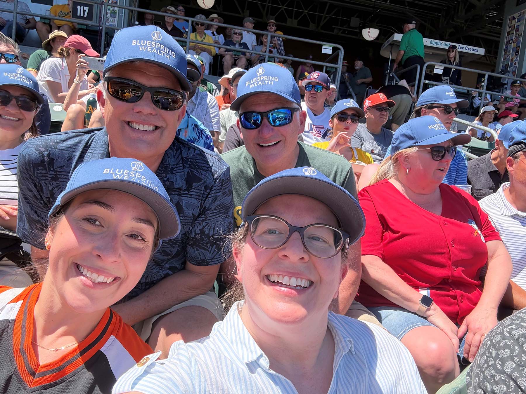 Casual event selfie representing authentic team engagement, client experiences, and community connection