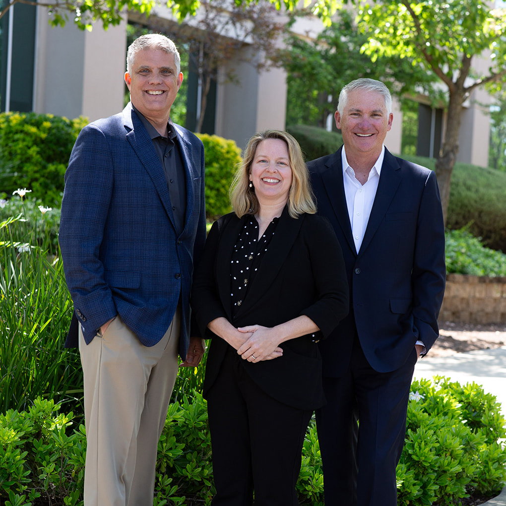 Leadership team portrait representing the firm’s current generation of advisors, collaborative leadership, and long-term stewardship of client relationships