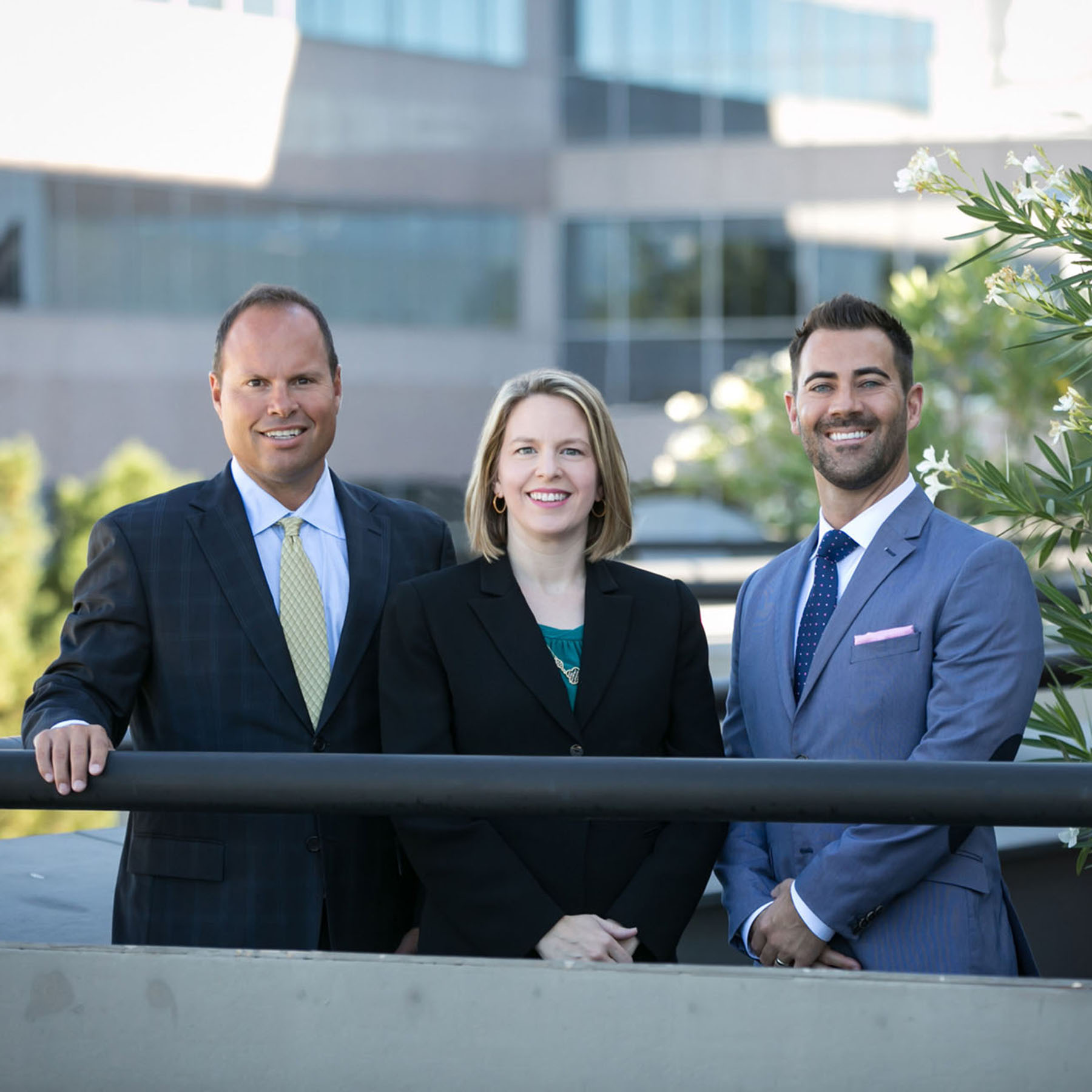 Professional leadership team portrait representing trusted advisors, executive accessibility, and established financial expertise within a modern corporate environment