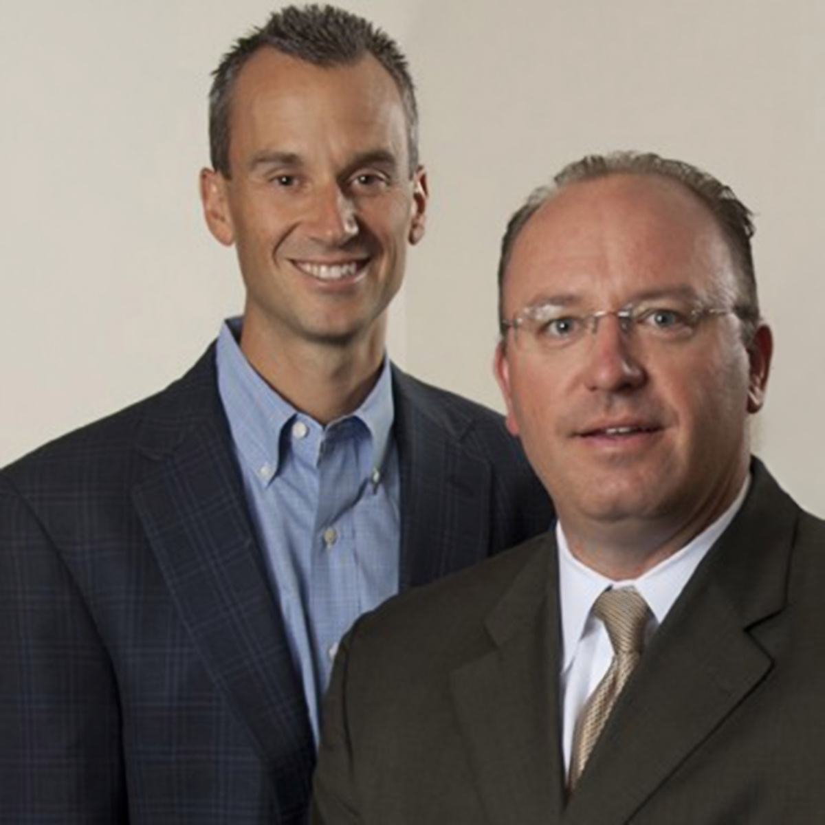 Founding partners or early leadership team portrait representing entrepreneurial beginnings, company history, and the foundation of long-term client relationships