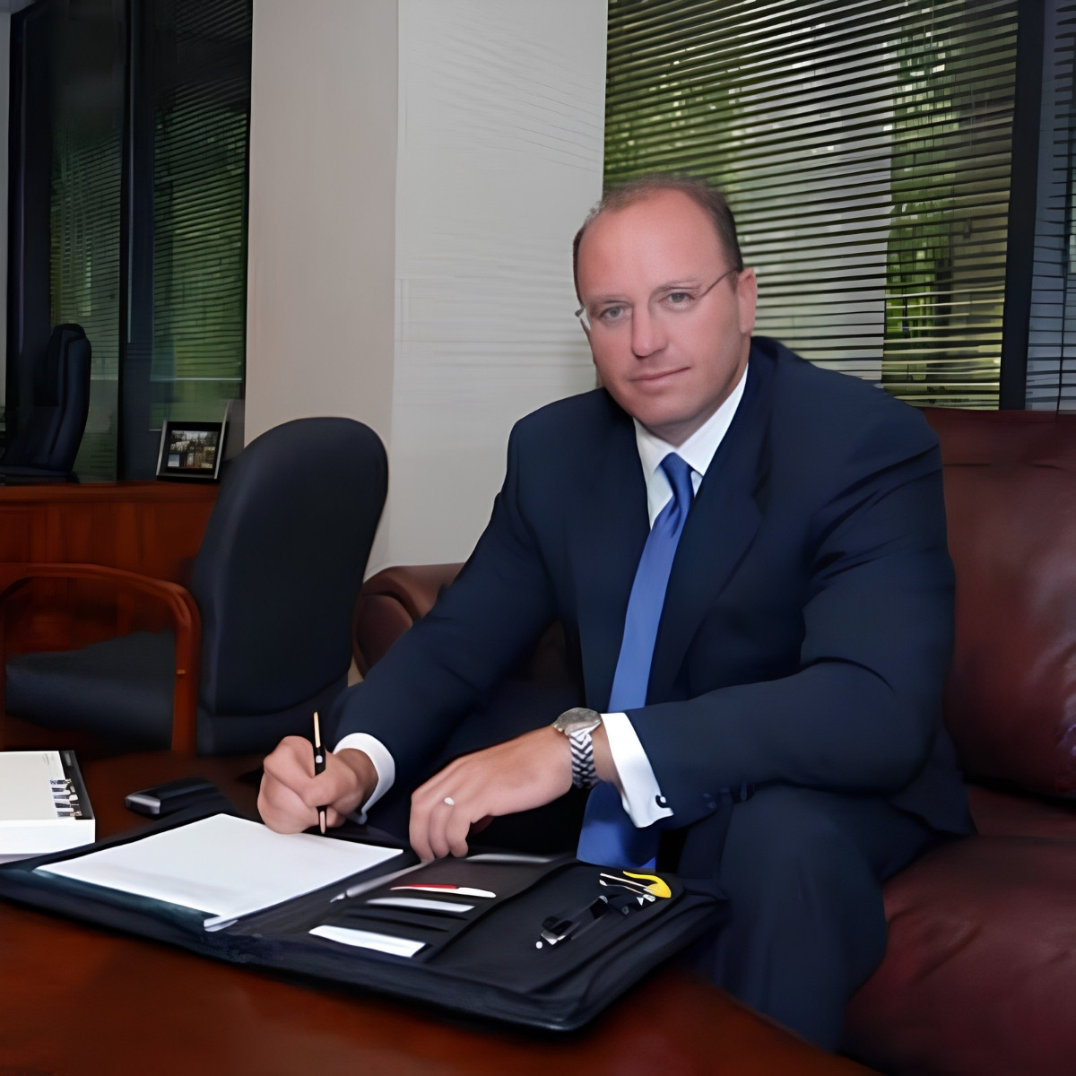 Executive office portrait of a business leader representing professionalism, financial expertise, strategic leadership, and client-focused advisory services