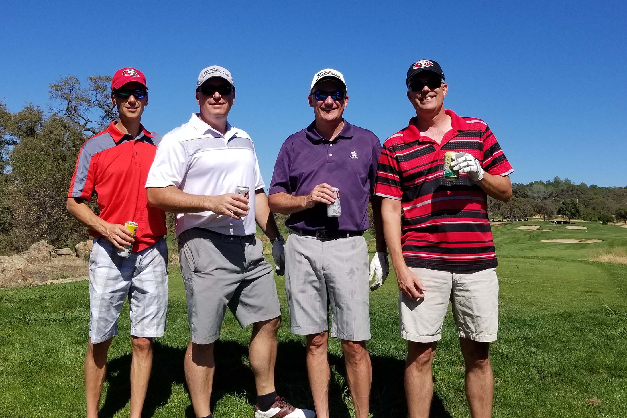 Four friends enjoying a day on the golf course representing relationship-building, leisure lifestyle, retirement activities, and social connection through recreation