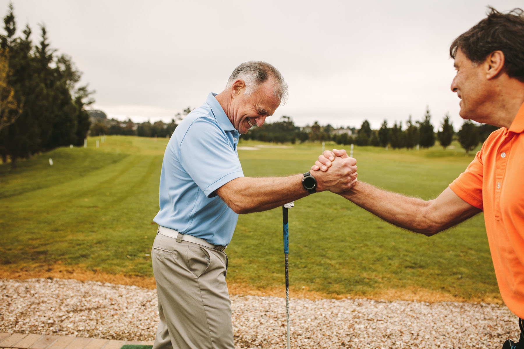 Golf course networking and partnership moment representing long-term relationships, camaraderie, trust, and personal connections beyond the office